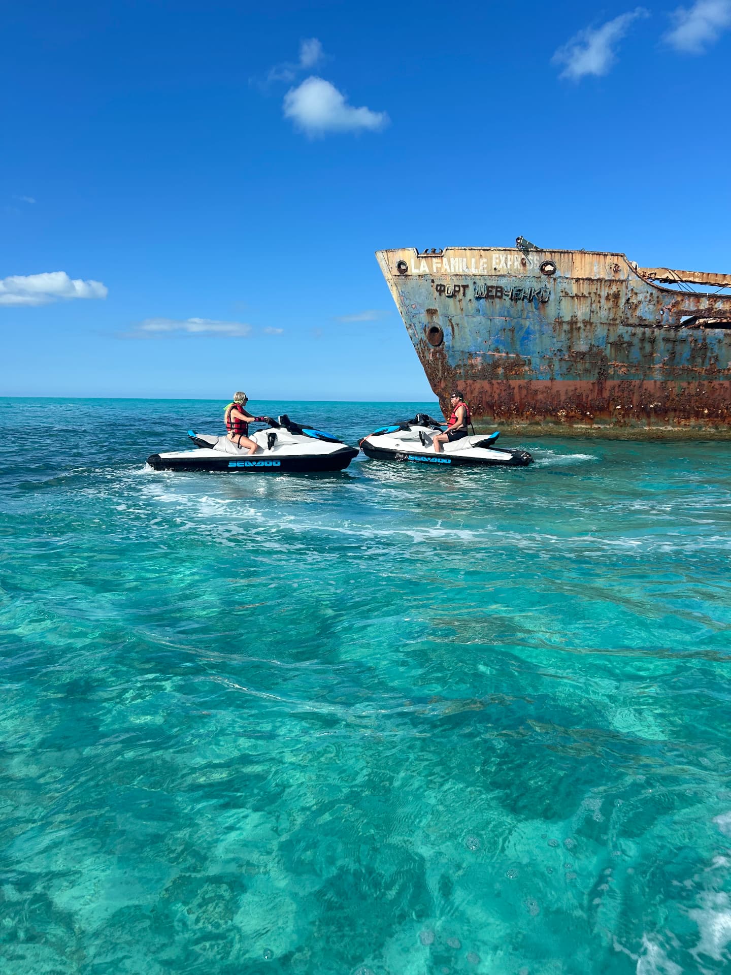Two jet skis beside the La Famille Express shipwreck in Turks and Caicos